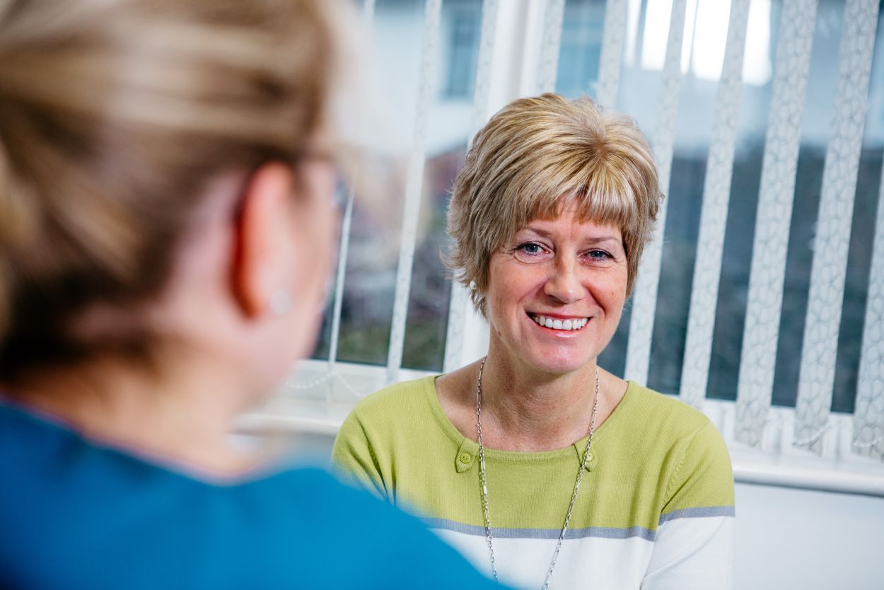 Dentist discussing composite bonding treatment with a patient at Glendair Dental
