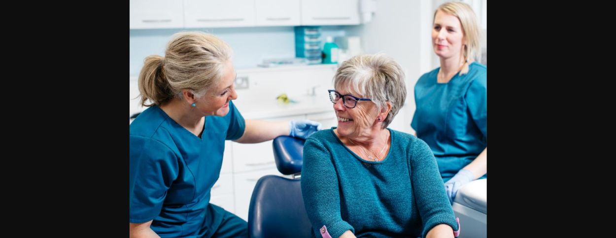 Dentist chatting with a patient during a first visit consultation at Glendair Dental